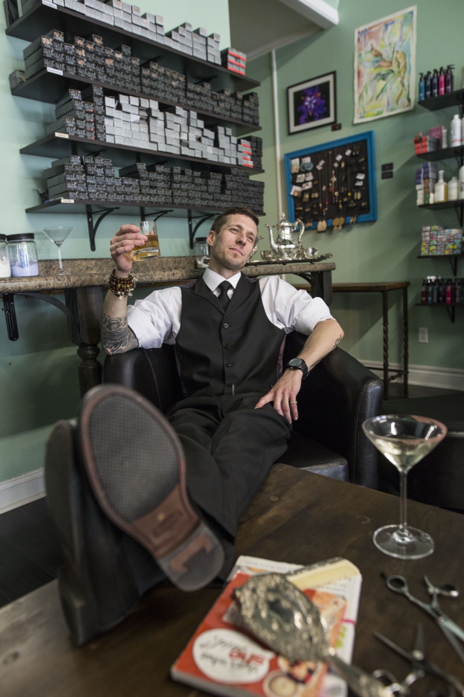 Portrait of Michael Brandon seated in the salon.